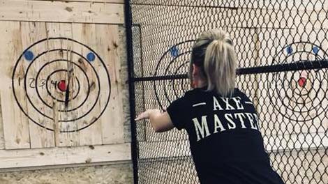 Female axe master throwing