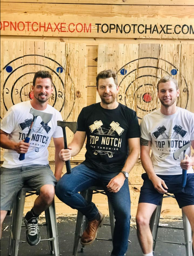 Pictured: Joe Prinster, Brett Eldredge and Steven Prinster at Top Notch Axe Throwing.